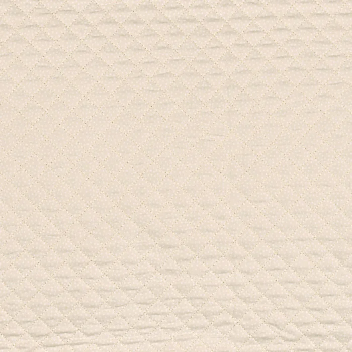 Et quiltet tekstil som er mykt og perfekt til å sy sengteppe eller sovepose til babyer.