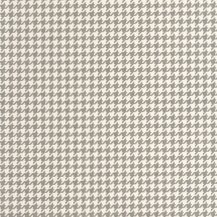 Klassisk hundetannmønstret/houndstooth tapet fra Casadeco på en stuevegg, kombinert med moderne interiør