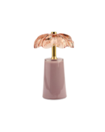 Dekorativ lampe med blomsterformet glasskjerm og moderne, sylindrisk base i en dus lilla-rosa farge
