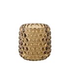 En sylindrisk telysholder i ravgult glass med et markant og dekorativt boblemønster over hele overflaten